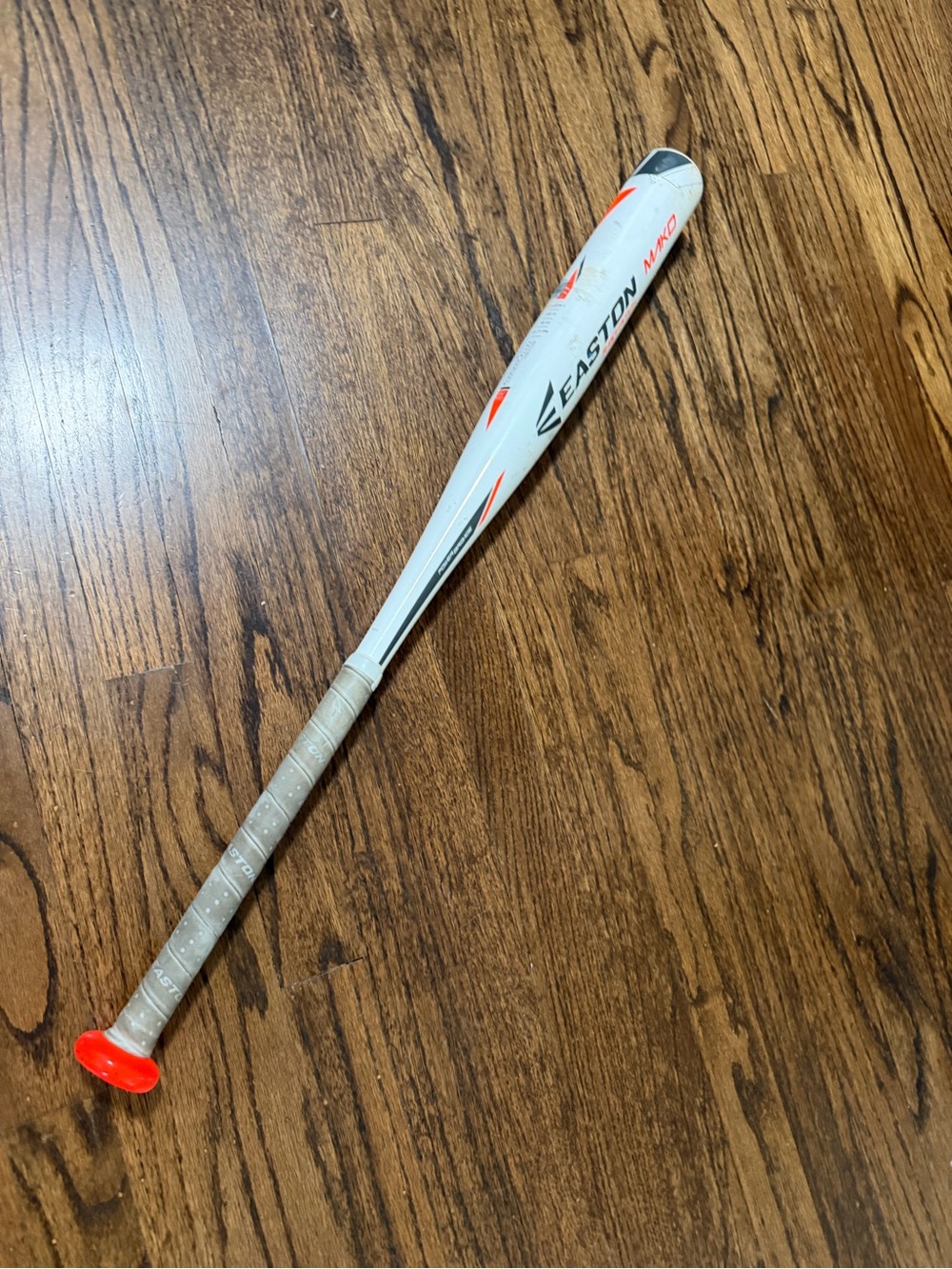 Easton White and Orange Youth Baseball Bat with Gray Grip